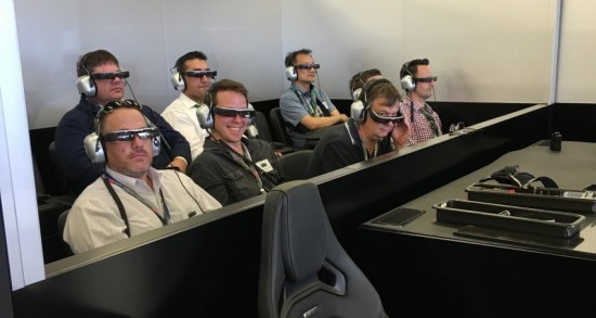 Journalists experiencing the Epson augmented reality glasses in the Mercedes team pit area at the 2016 Australian F1 GP 
